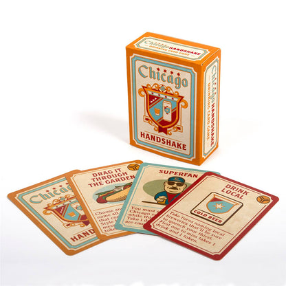 Chicago Handshake card game set with an orange and cream box standing upright and four illustrated cards fanned in front on a white background.