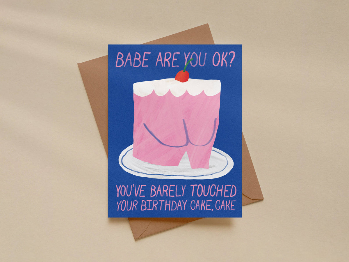 Card with a pink cake illustration and humorous text on a beige background